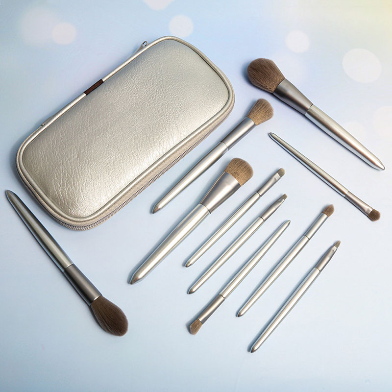 Silver makeup brush with leather bag